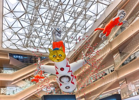 tokyo, japan - may 14 2024: Bottom view of the Japanese Contemporary Art installation BIG CAT BANG created by Kenji Yanobe exhibited in the atrium of the Ginza Six Department Store until summer 2025.