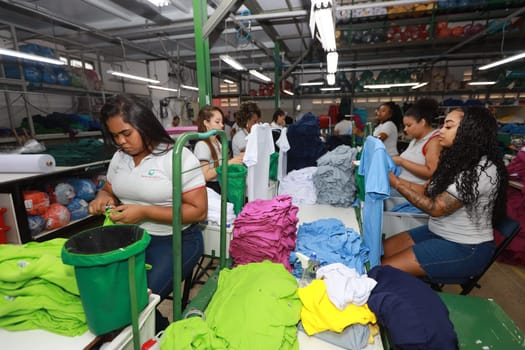 salvador, bahia, brazil - june 7, 2024: seamstress working in a textile factory in the city of Salvador.