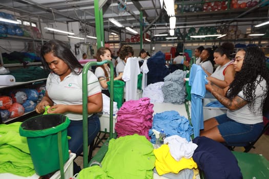 salvador, bahia, brazil - june 7, 2024: seamstress working in a textile factory in the city of Salvador.