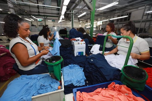 salvador, bahia, brazil - june 7, 2024: seamstress working in a textile factory in the city of Salvador.
