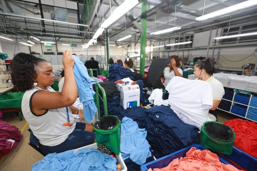 salvador, bahia, brazil - june 7, 2024: seamstress working in a textile factory in the city of Salvador.