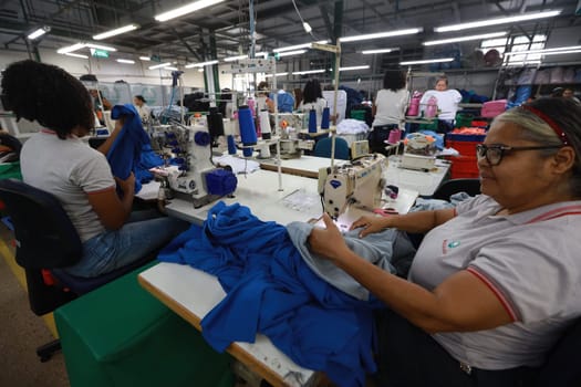 salvador, bahia, brazil - june 7, 2024: seamstress working in a textile factory in the city of Salvador.