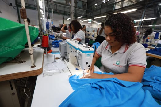 salvador, bahia, brazil - june 7, 2024: seamstress working in a textile factory in the city of Salvador.
