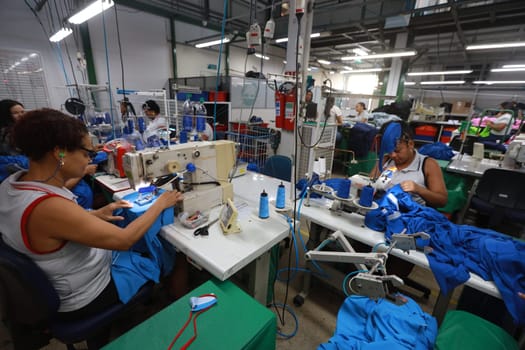 salvador, bahia, brazil - june 7, 2024: seamstress working in a textile factory in the city of Salvador.