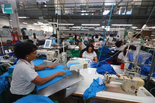salvador, bahia, brazil - june 7, 2024: seamstress working in a textile factory in the city of Salvador.