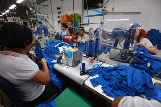 salvador, bahia, brazil - june 7, 2024: seamstress working in a textile factory in the city of Salvador.