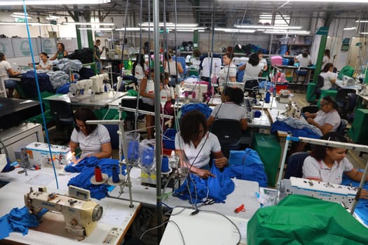 salvador, bahia, brazil - june 7, 2024: seamstress working in a textile factory in the city of Salvador.