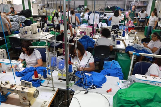 salvador, bahia, brazil - june 7, 2024: seamstress working in a textile factory in the city of Salvador.