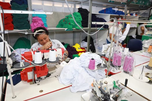 salvador, bahia, brazil - june 7, 2024: seamstress working in a textile factory in the city of Salvador.