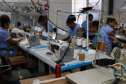 salvador, bahia, brazil - june 7, 2024: seamstress working in a textile factory in the city of Salvador.