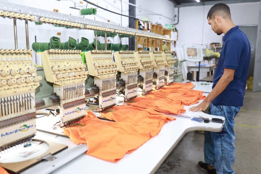 salvador, bahia, brazil - june 7, 2024: seamstress working in a textile factory in the city of Salvador.