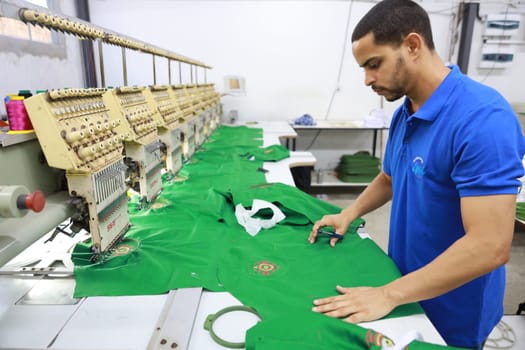 salvador, bahia, brazil - june 7, 2024: seamstress working in a textile factory in the city of Salvador.