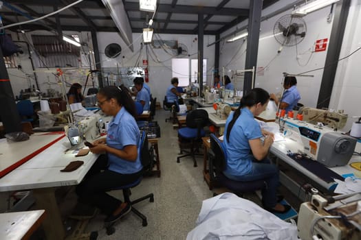 salvador, bahia, brazil - june 7, 2024: seamstress working in a textile factory in the city of Salvador.