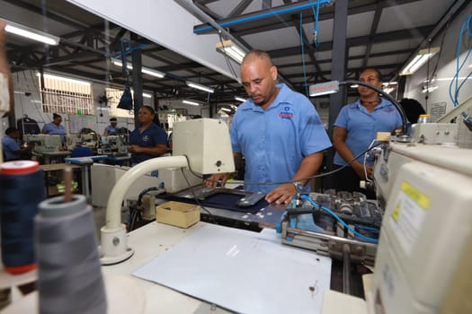 salvador, bahia, brazil - june 7, 2024: seamstress working in a textile factory in the city of Salvador.