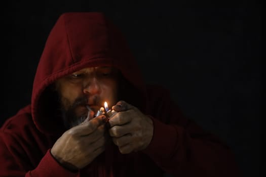 salvador, bahia, brazil - october 10, 2022: Crock user smoking the drug with a metal pipe in Salvador city.