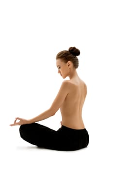 Topless woman meditating, isolated on white backdrop