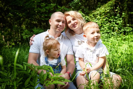 Family playing in the forest