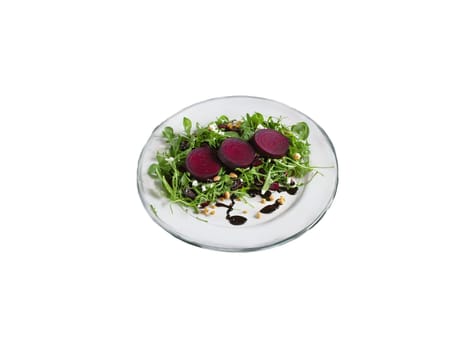 Gluten free beet and goat cheese salad with arugula and balsamic glaze served. Food isolated on transparent background.