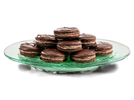 Chocolate dark chocolate mint patties with a creamy center on a transparent glass dish refreshing. Food isolated on transparent background.