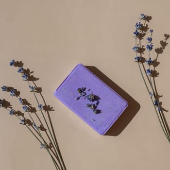 Handmade aromatic spa lavender soap. Natural additives and extracts. Bar of lavender soap with dried flowers. Beauty treatment product herbal ecological organic cosmetics. Copy space