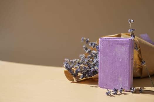 Handmade aromatic spa lavender soap. Natural additives and extracts. Bar of lavender soap with dried flowers. Beauty treatment product herbal ecological organic cosmetics. Copy space