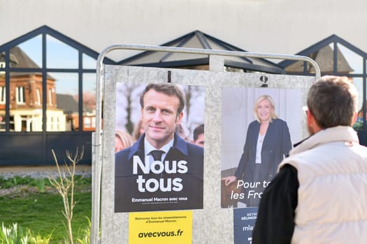 PARIS, FRANCE - APRIL 20, 2022 : The banners with candidates for President elections