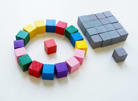 Hierarchy of company of the leader and manager. Structures of colored cubes and gray ones.