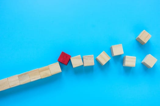 The red cube as unexpected problem or obstacle breaks the line.