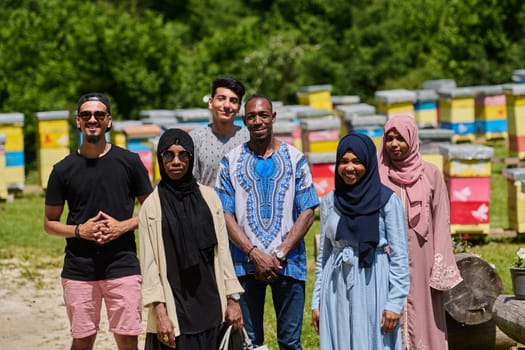 A diverse group of young friends and entrepreneurs explore small honey production businesses in the natural setting of the countryside