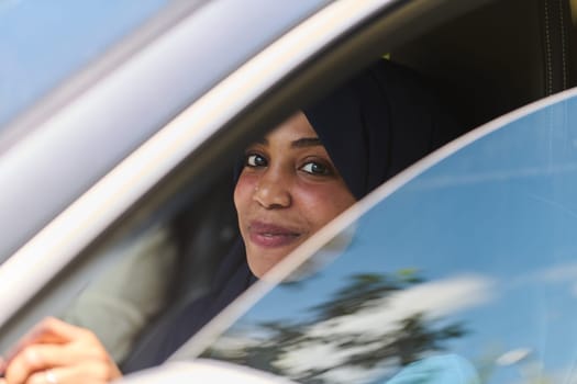 A Middle Eastern teenage girl enjoys a drive through scenic nature, embracing the freedom and beauty of the outdoors.