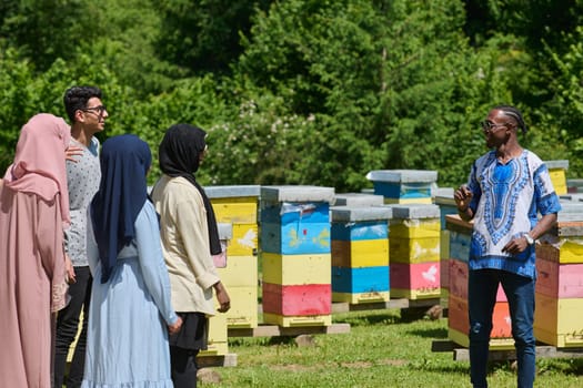 A diverse group of young friends and entrepreneurs explore small honey production businesses in the natural setting of the countryside