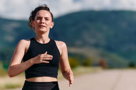 Rain or shine, a dedicated woman powers through her training run, her eyes set on the finish line.