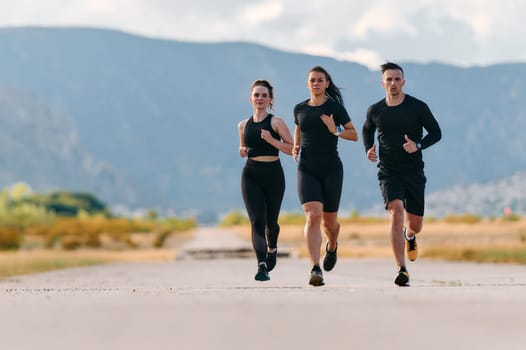 A professional athletic team as they train rigorously, running towards peak performance in preparation for an upcoming marathon.