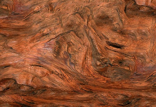 Abstract background of uneven and curved lacquered brown wood panel