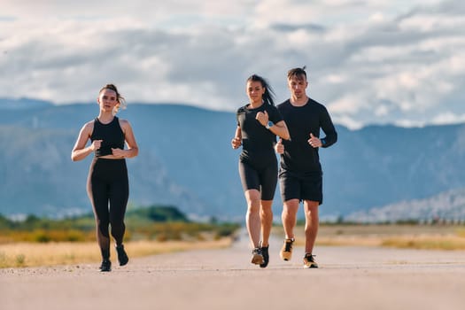 A professional athletic team as they train rigorously, running towards peak performance in preparation for an upcoming marathon.