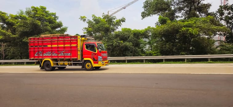 truck one of transportation mode making local commercial delivery at urban city and on the city streets in asia logistical transport system in Asian country Indonesia