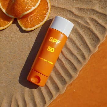SPF 50. Sunscreen. High quality photo. Sunscreen. Summer cream. Tanning product. Tanning remedy. Cream on vacation and vacation. Cream on the seashore on wet sand
