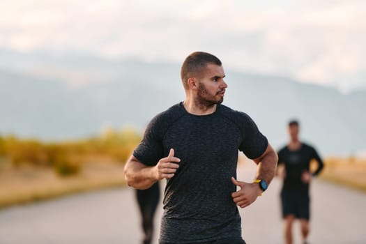 A professional athletic team as they train rigorously, running towards peak performance in preparation for an upcoming marathon.