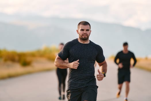 A professional athletic team as they train rigorously, running towards peak performance in preparation for an upcoming marathon.