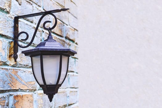 a lamp with a transparent case protecting the flame or electric bulb