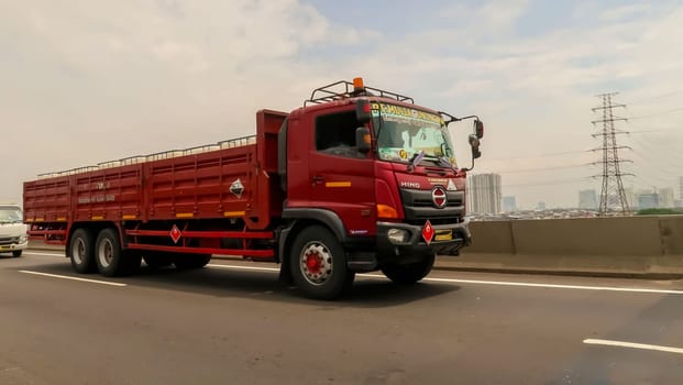 truck one of transportation mode making local commercial delivery at urban city and on the city streets in asia logistical transport system in Asian country Indonesia