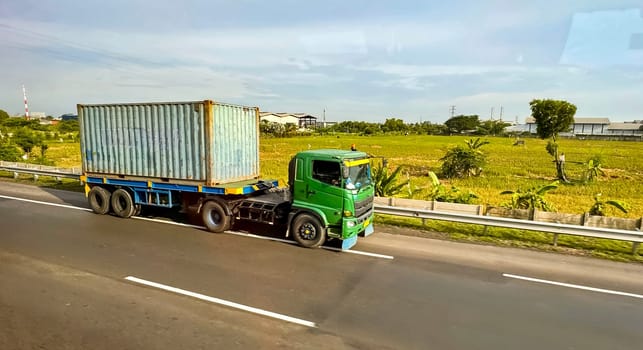 truck one of transportation mode making local commercial delivery at urban city and on the city streets in asia logistical transport system in Asian country Indonesia