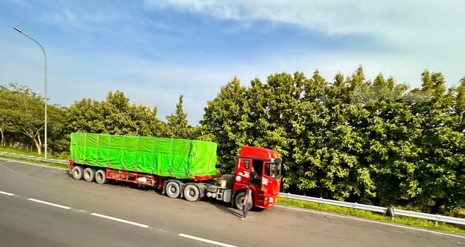 truck one of transportation mode making local commercial delivery at urban city and on the city streets in asia logistical transport system in Asian country Indonesia