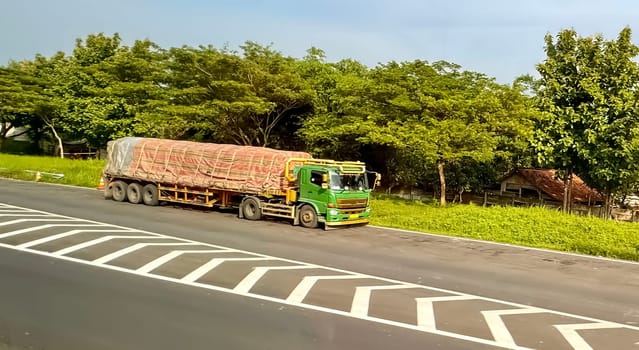 truck one of transportation mode making local commercial delivery at urban city and on the city streets in asia logistical transport system in Asian country Indonesia