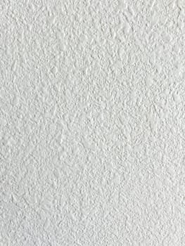 Detailed view of a ceiling texture after the removal of a popcorn ceiling. The image highlights the smooth, updated finish, showcasing the results of a common home improvement project.