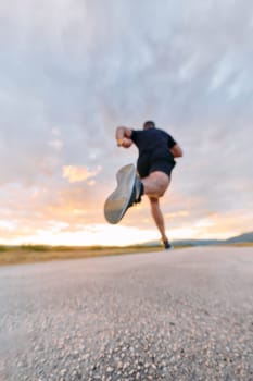 A breathtaking wide shot captures a determined man gracefully running against the backdrop of a vibrant sunset