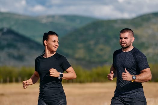 A couple embraces a healthy lifestyle by running together on a sunny day, exemplifying dedication to fitness and wellness in their partnership