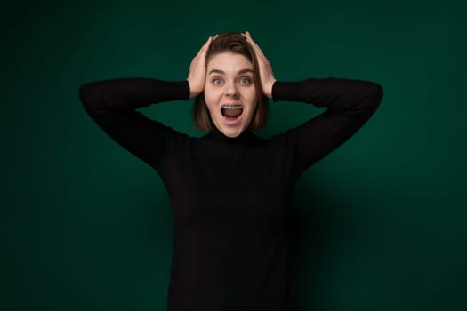 A woman is shown standing with her hands placed on top of her head in an expression of distress or frustration. She appears to be deep in thought or experiencing a moment of overwhelm.