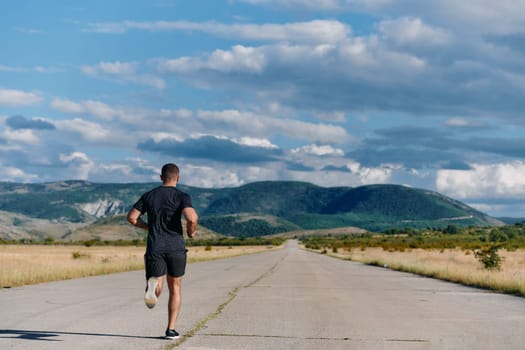 An athletic man jogs under the sun, conditioning his body for life's extreme challenges, exuding determination and strength in his preparation for the journey ahead