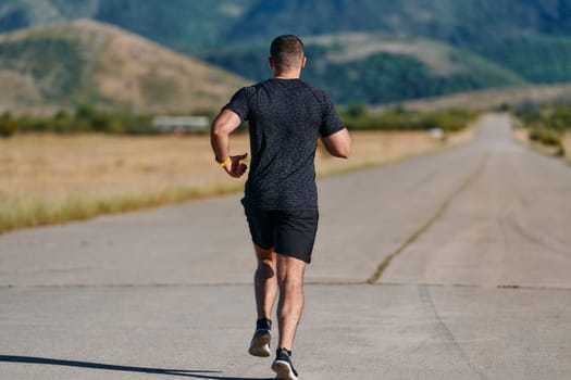 An athletic man jogs under the sun, conditioning his body for life's extreme challenges, exuding determination and strength in his preparation for the journey ahead